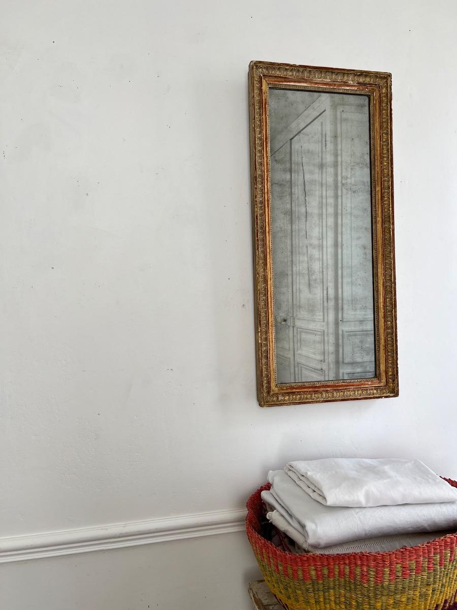 Miroir mercure époque Empire décor palmettes
