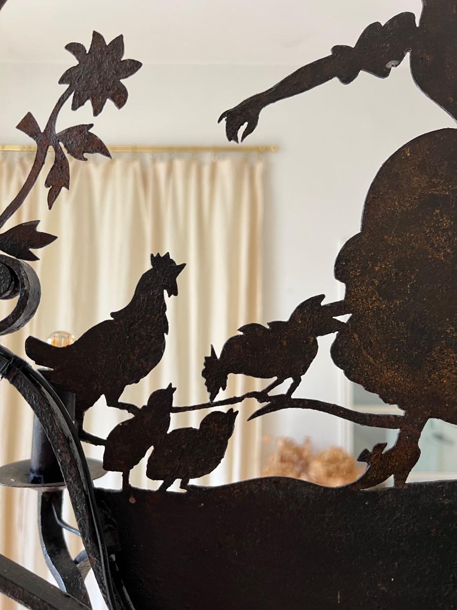 Lustre fer forgé décor silhouette 1920
